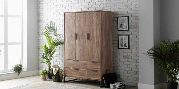 Habitat Nomad 3-door 4-drawer oak-effect wardrobe.